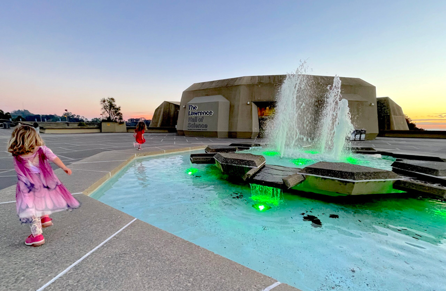 A child walks on the plaza at The Lawrence